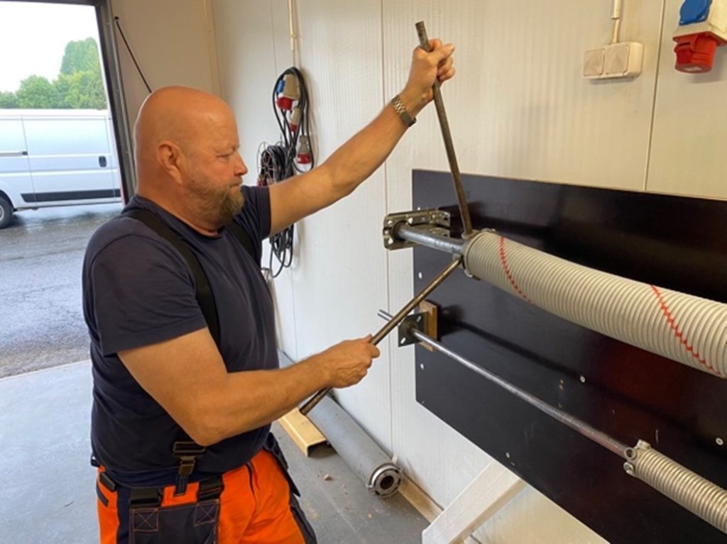 Installation using traditional spring winding bars.